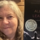 Laurie Easter showing her book "All the Leavings "